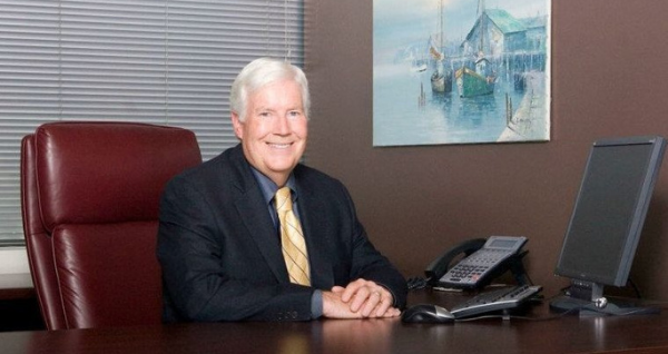 Craig Huey in his office desk