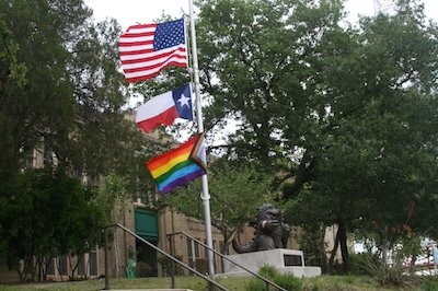 USA national flag, along with LGBTQ flag and another flag