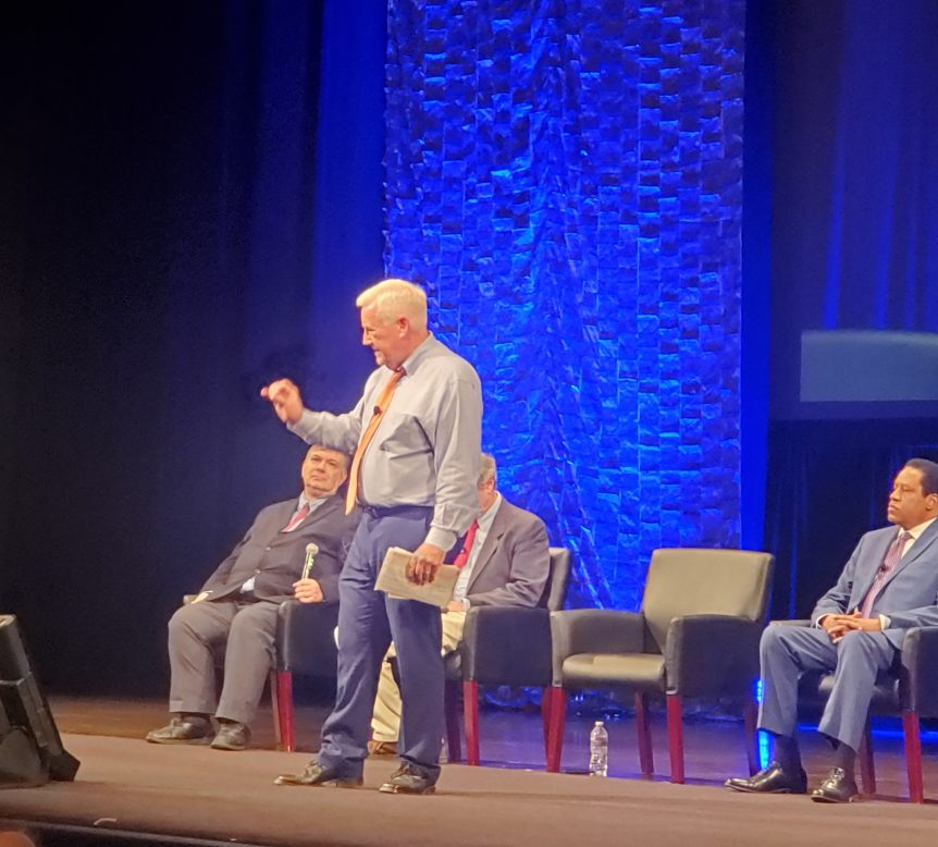 Craig Huey is giving a speech