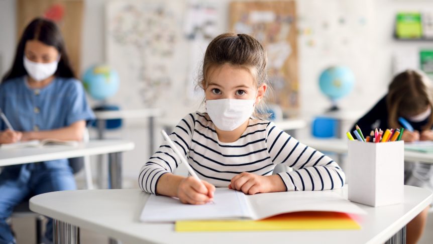 Kids are standing in the classroom