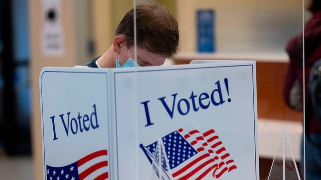 People are casting their vote in the pooling booth