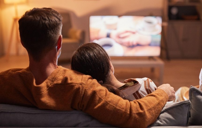 A couple is watching television