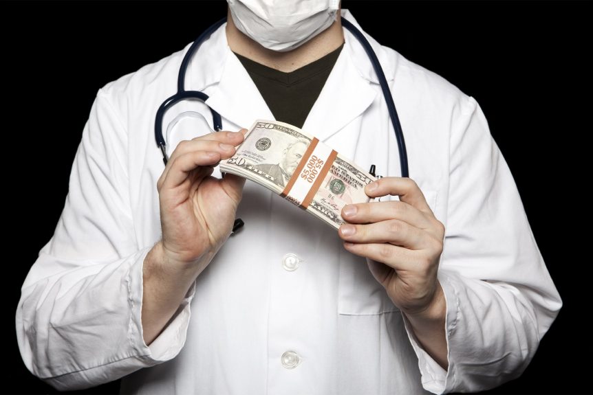 A doctor holding a bundle of dollar