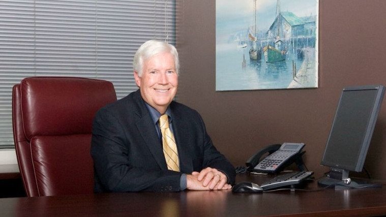 Craig Huey is sitting in his office