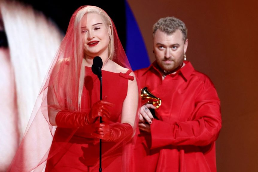 A singer accepting an award at the Grammy's
