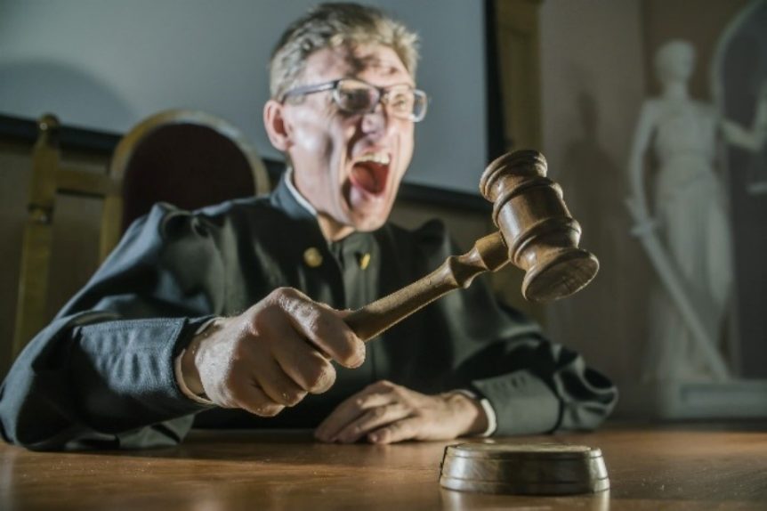 A judge is shouting in the courtroom.
