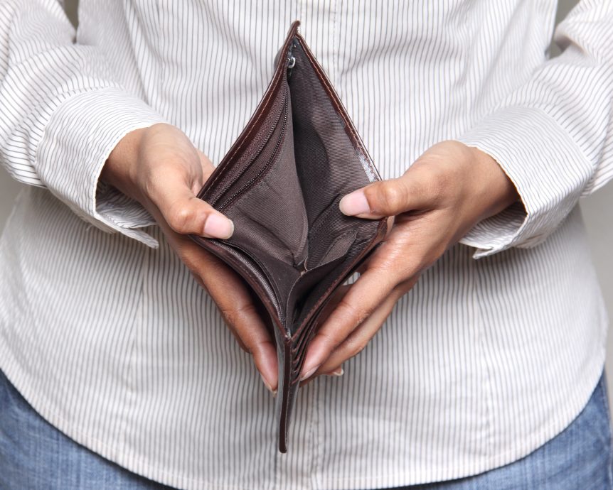 A man is holding a empty wallet
